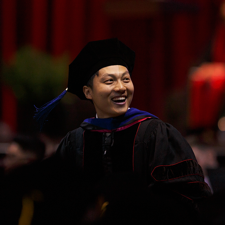 A smiling graduate