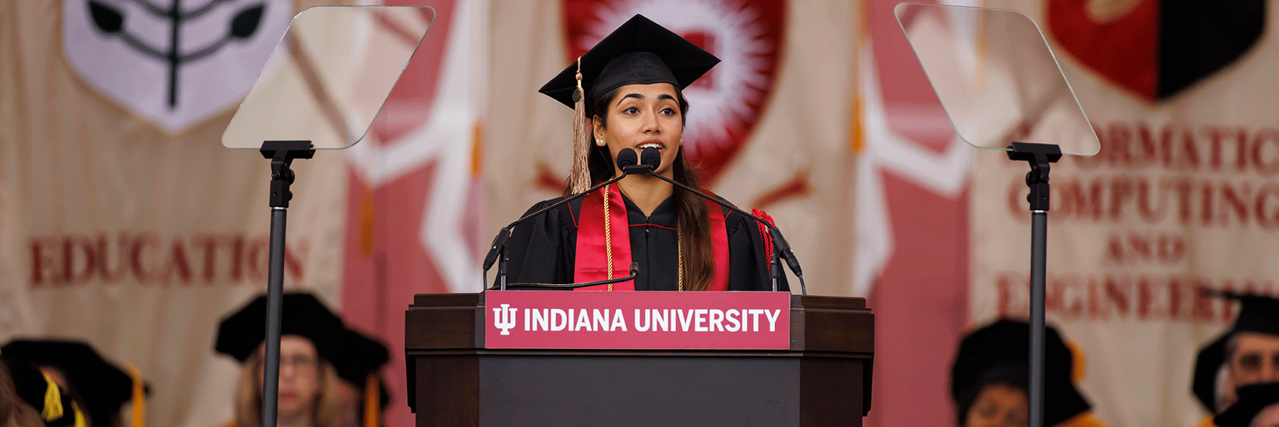 Gayatri Thiru, the undergraduate student commencement speaker, at the podium during the ceremony.