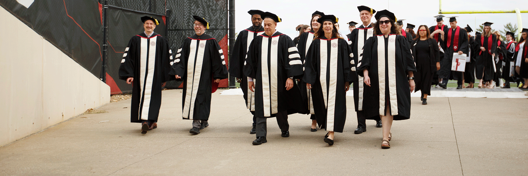 Faculty members walk into Commencement.